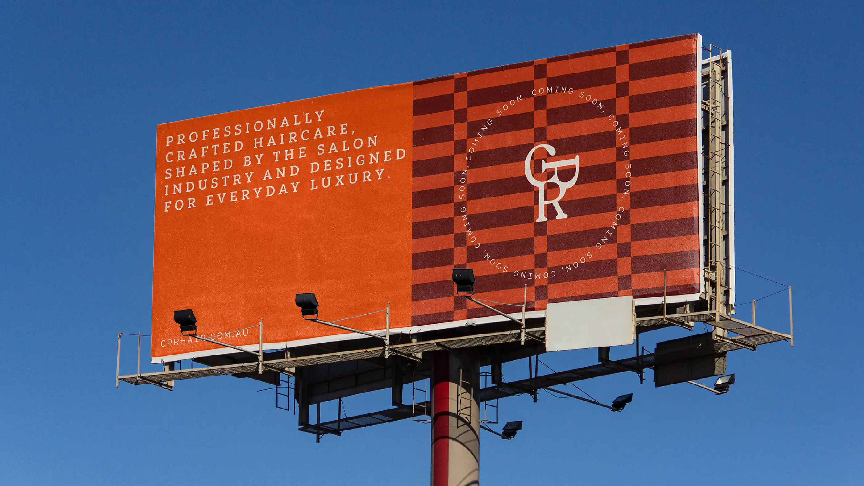 CPR Hair billboard in rust red and checkerboard, reading 'Professionally crafted haircare shaped by the salon industry and designed for everyday luxury'
