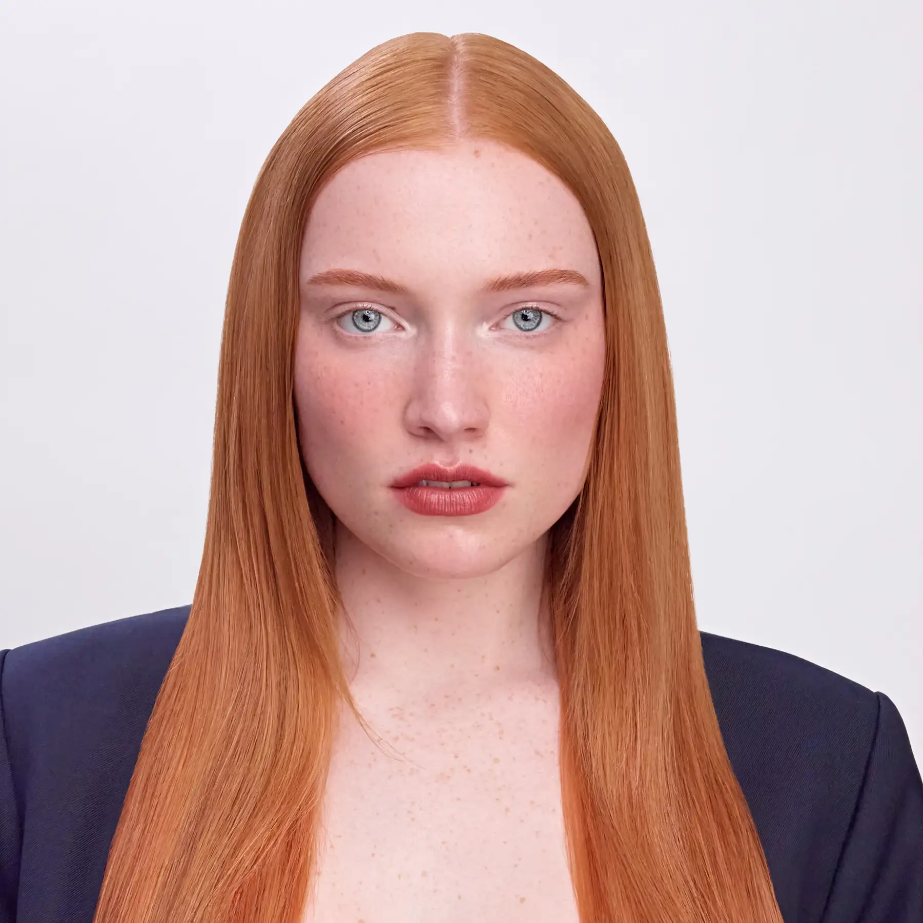 CPR Hair editorial portrait of a model with long straight copper hair