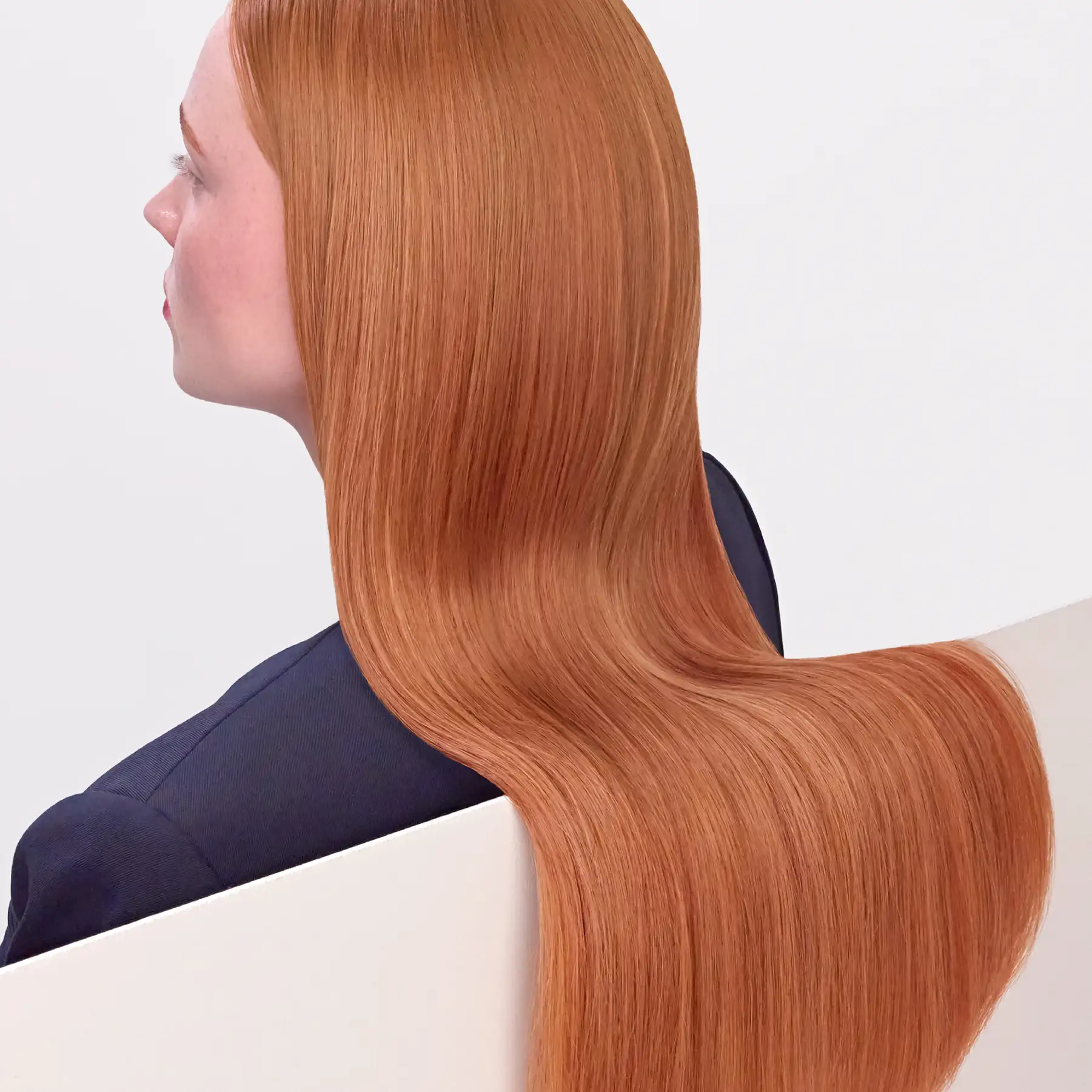 CPR Hair editorial photography — profile of a model with smooth copper hair