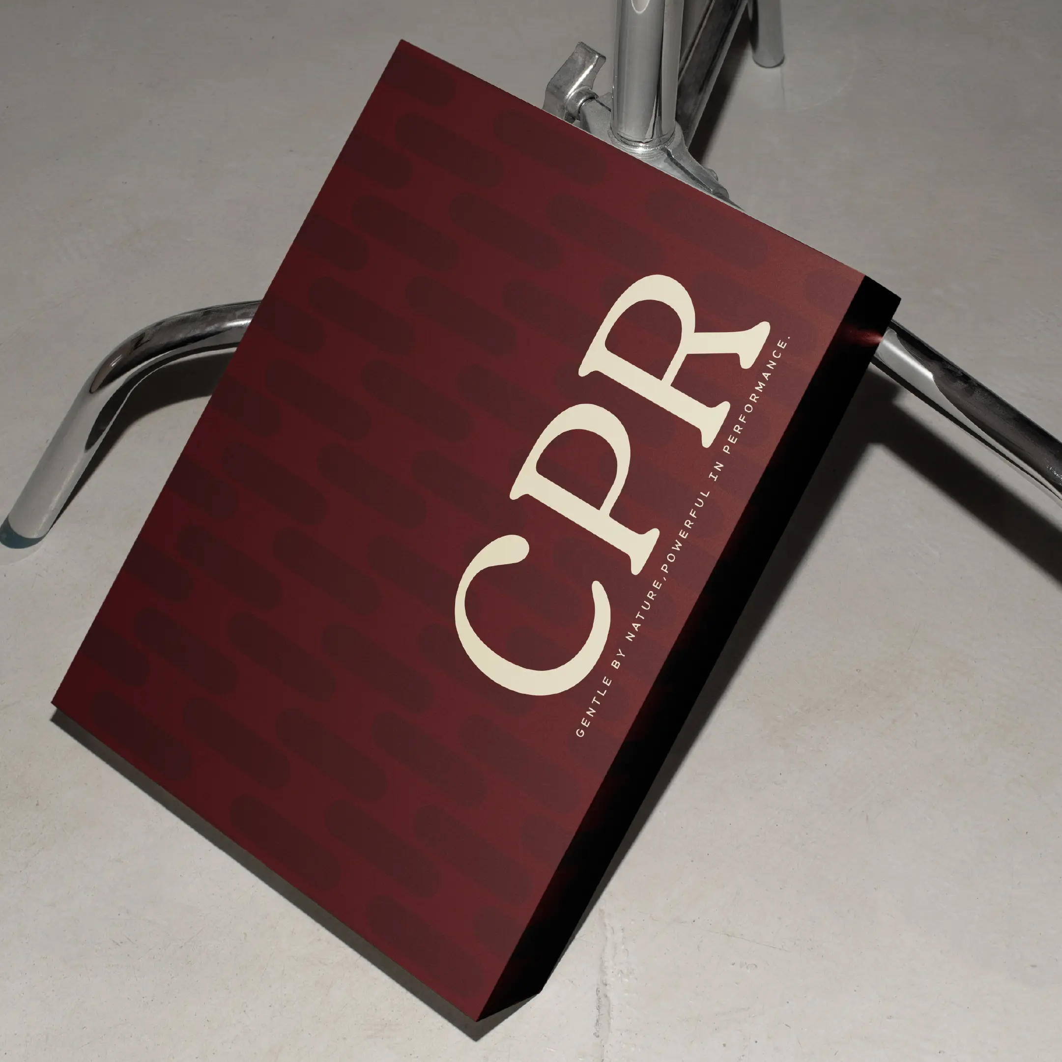 CPR Hair packaging — a deep red box with the logotype and checkerboard emboss