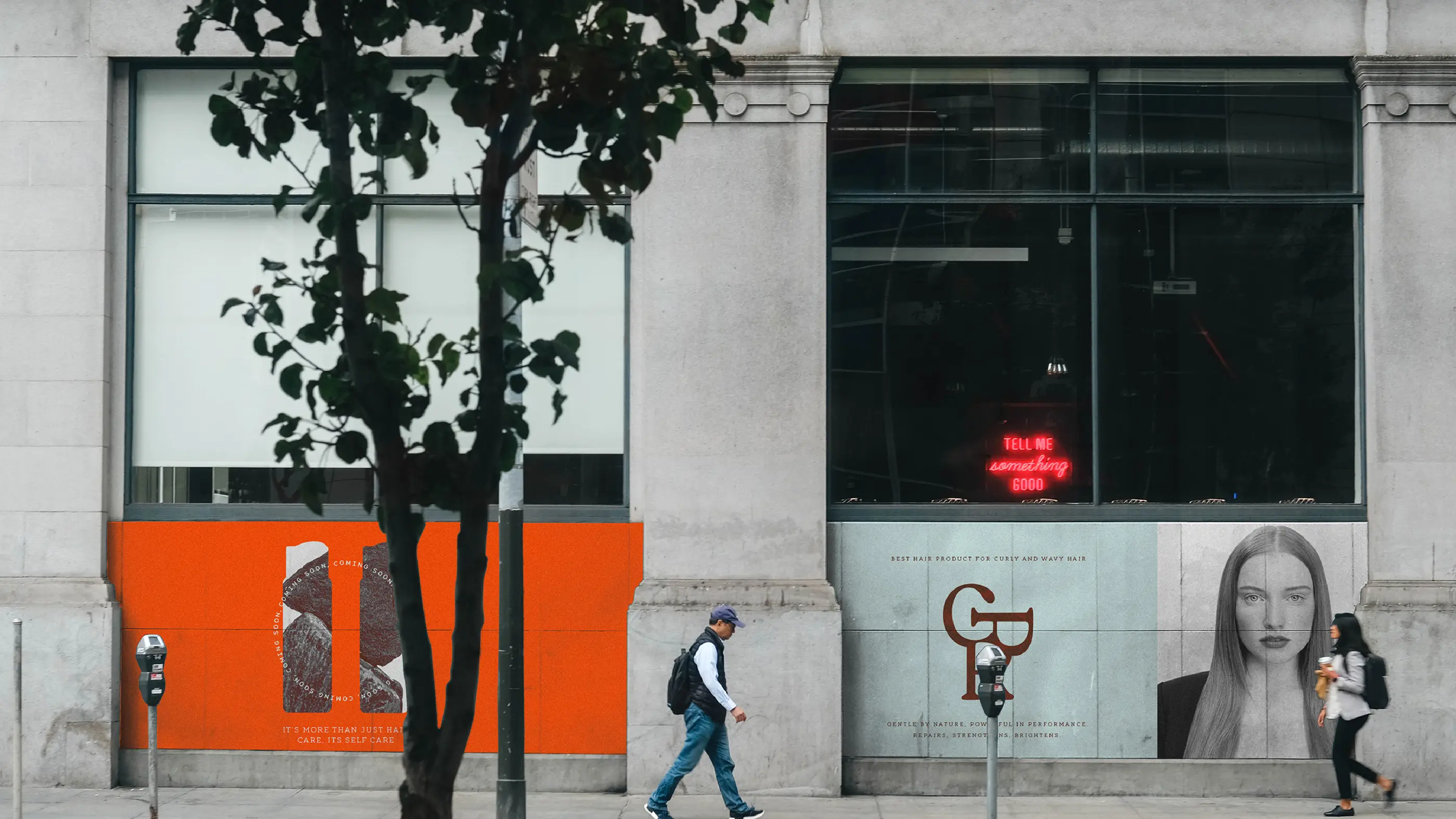 CPR Hair brand applied to a shopfront, with orange panelling and window portraits