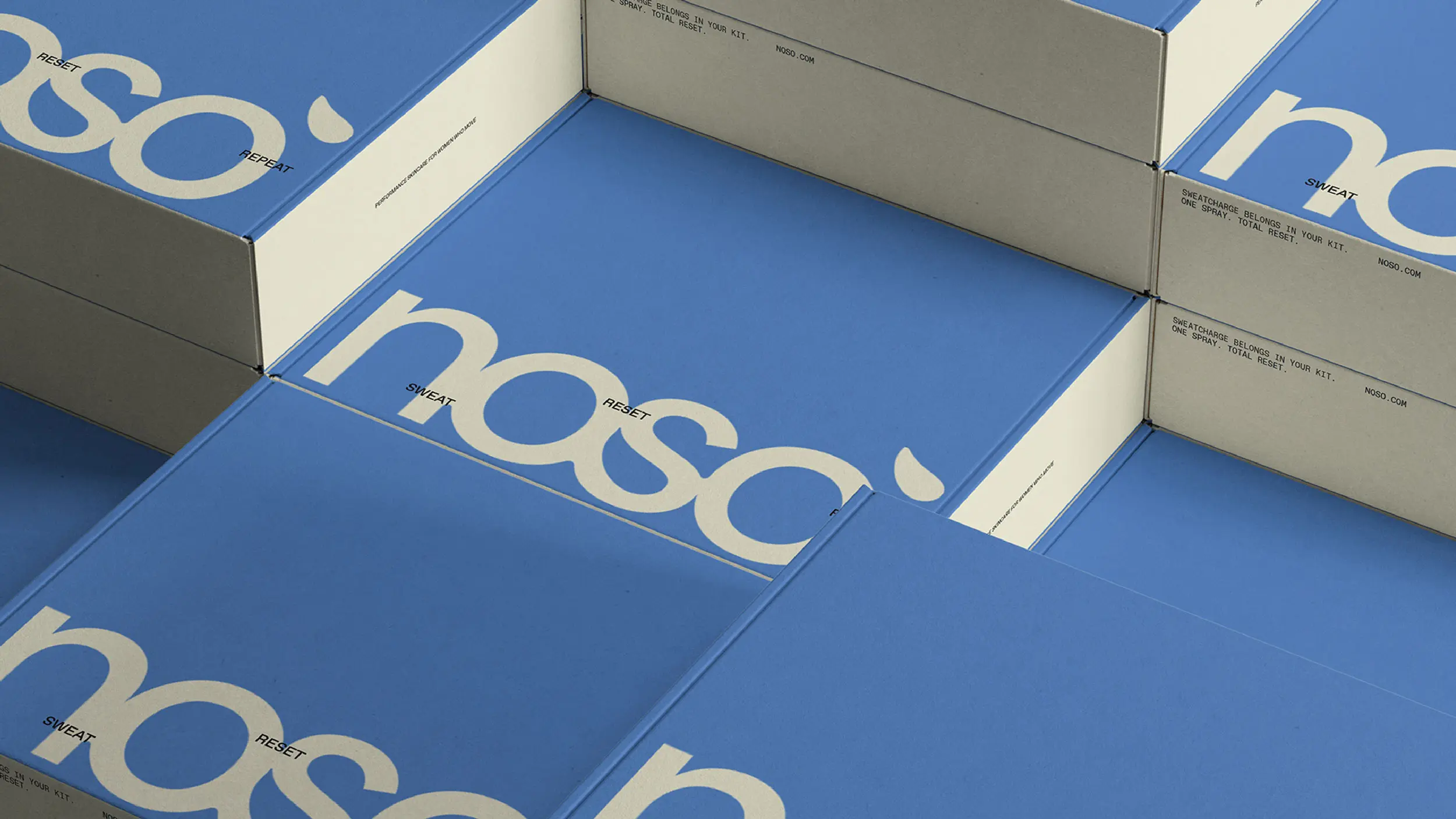 Noso branded packaging boxes in blue and cream