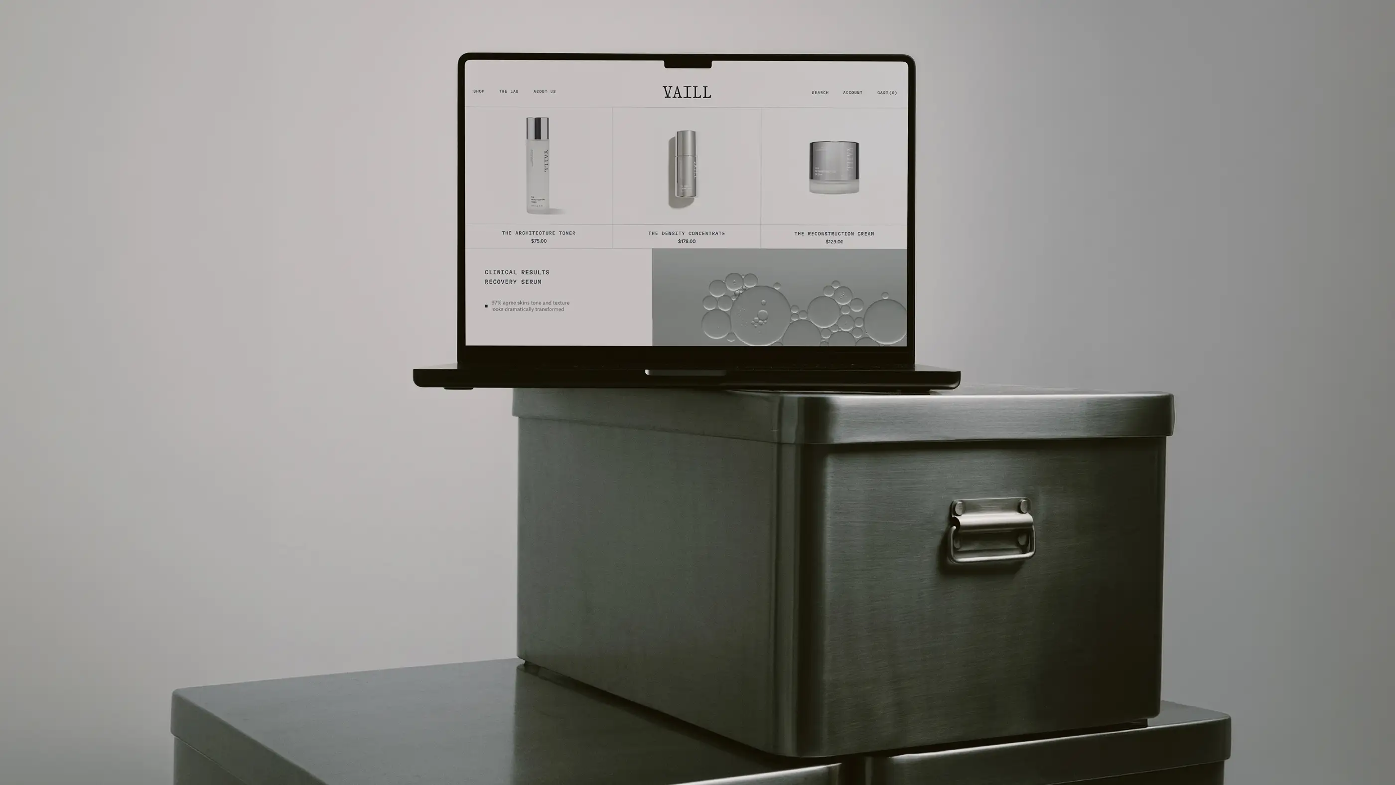 Vaill website shown on a laptop resting on a dark metal box