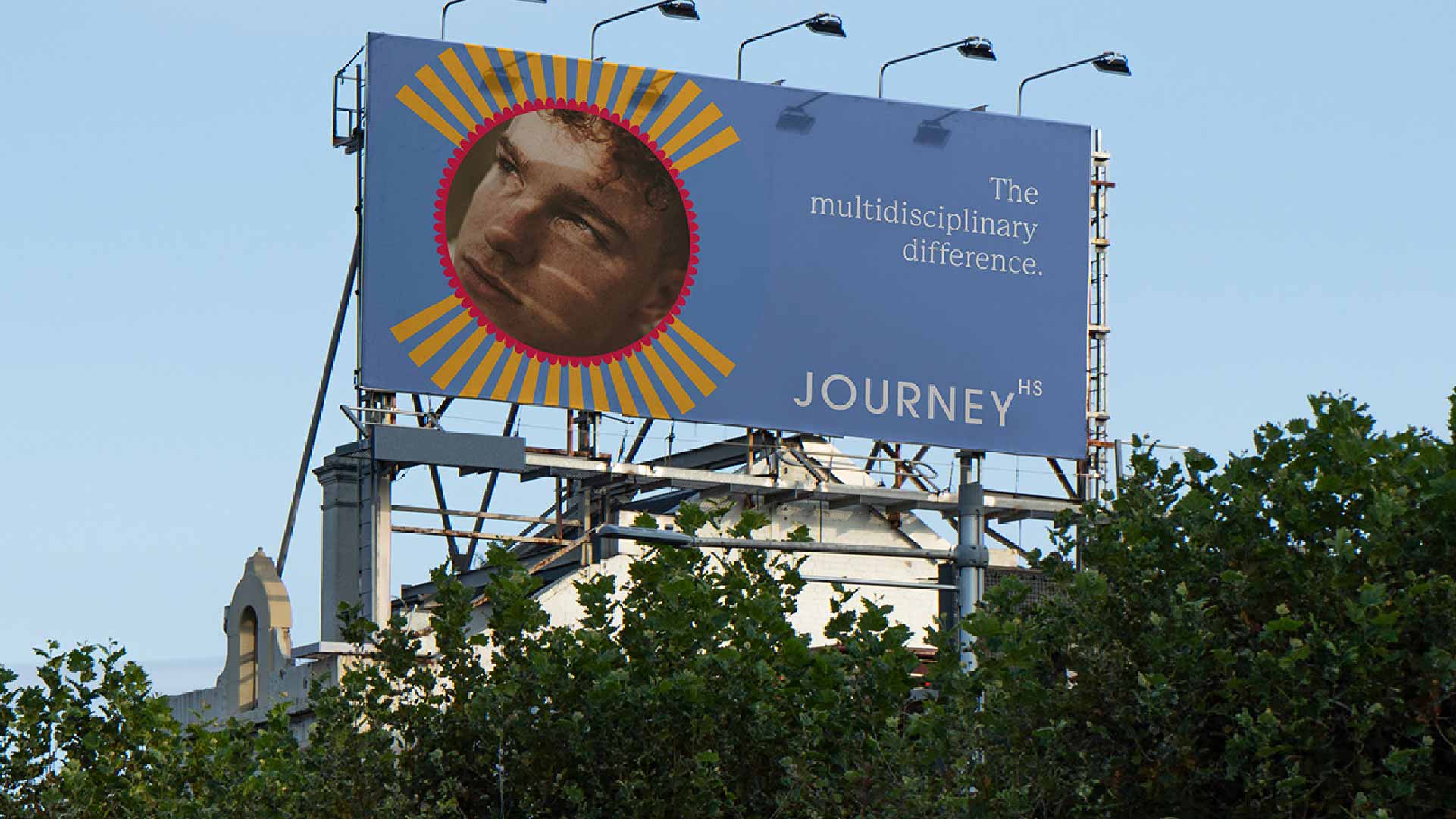 Journey brand campaign billboard beside a rooftop