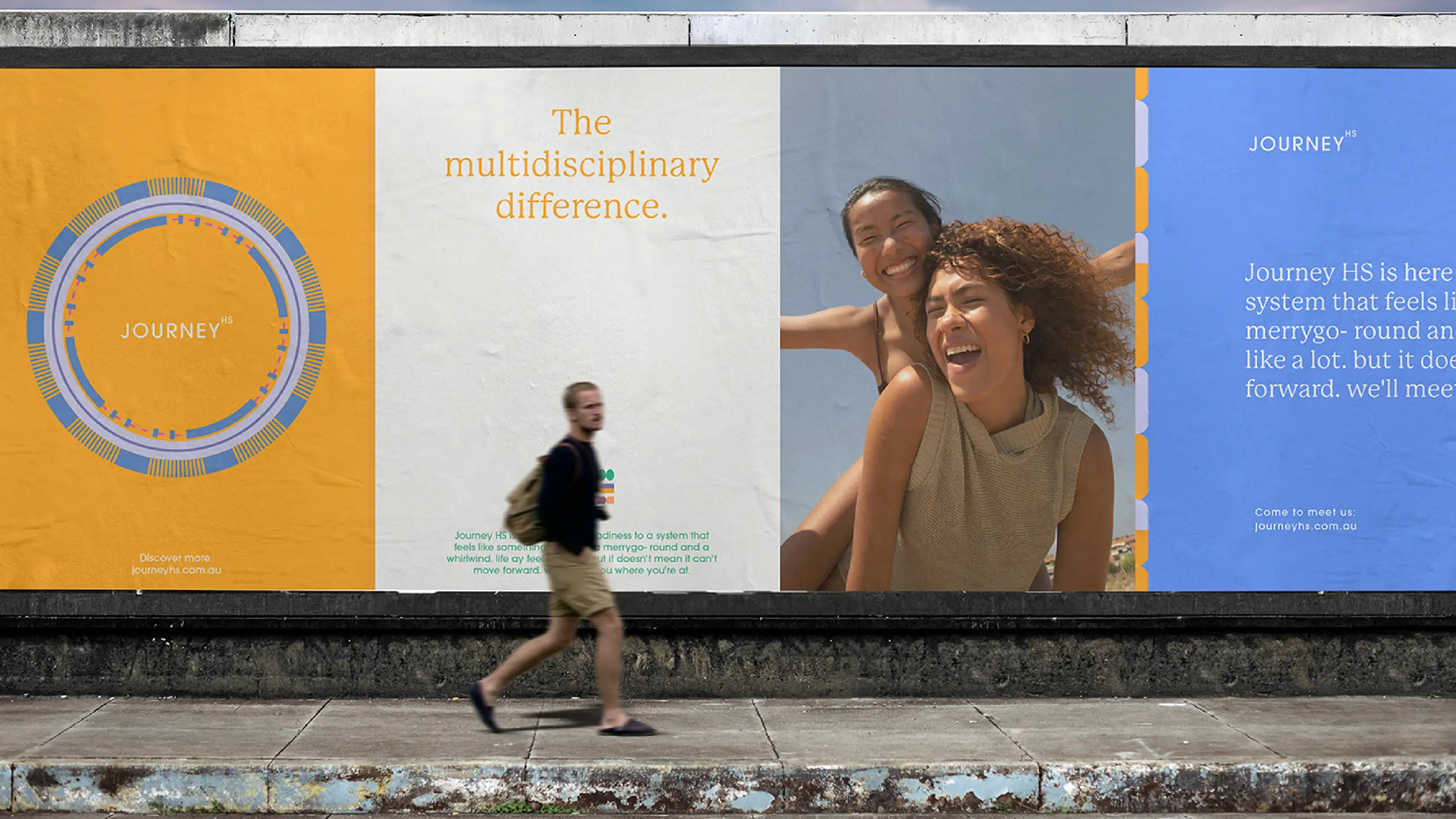 Journey HS hoarding on a street, reading 'The multidisciplinary difference' with campaign photography